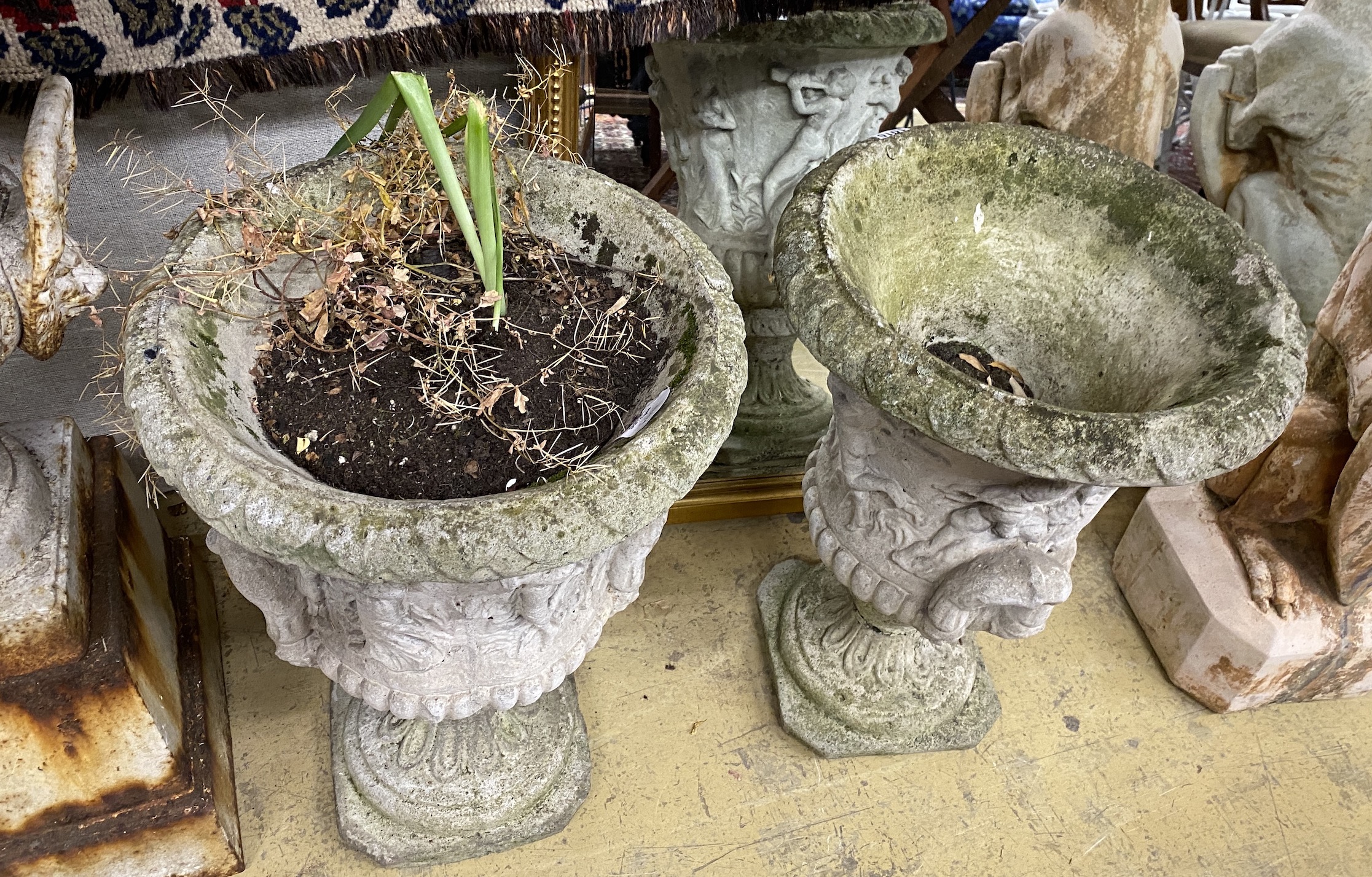 A pair of reconstituted stone campana garden urns, diameter 38cm, height 56cm